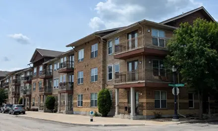 Villa at Vanston multifamily building in brick with projecting balconies
